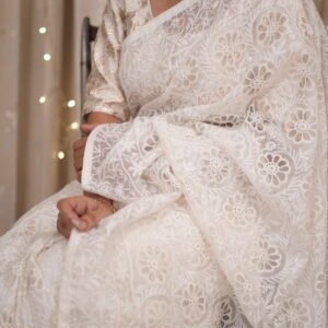 White colored silk organza saree with delicate tapechi embroidery and cutwork