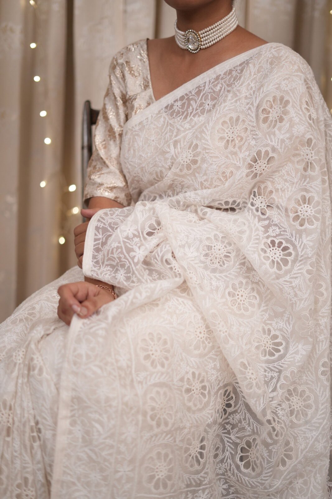 DSC04869 White colored silk organza saree with delicate tapechi embroidery and cutwork - Image 1