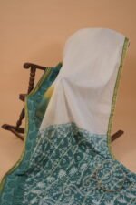 White embroidered saree with blue shade pallu