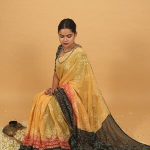 Yellow saree with black pallu shaded border in red and black