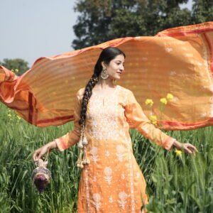 Woman in orange dress outdoors